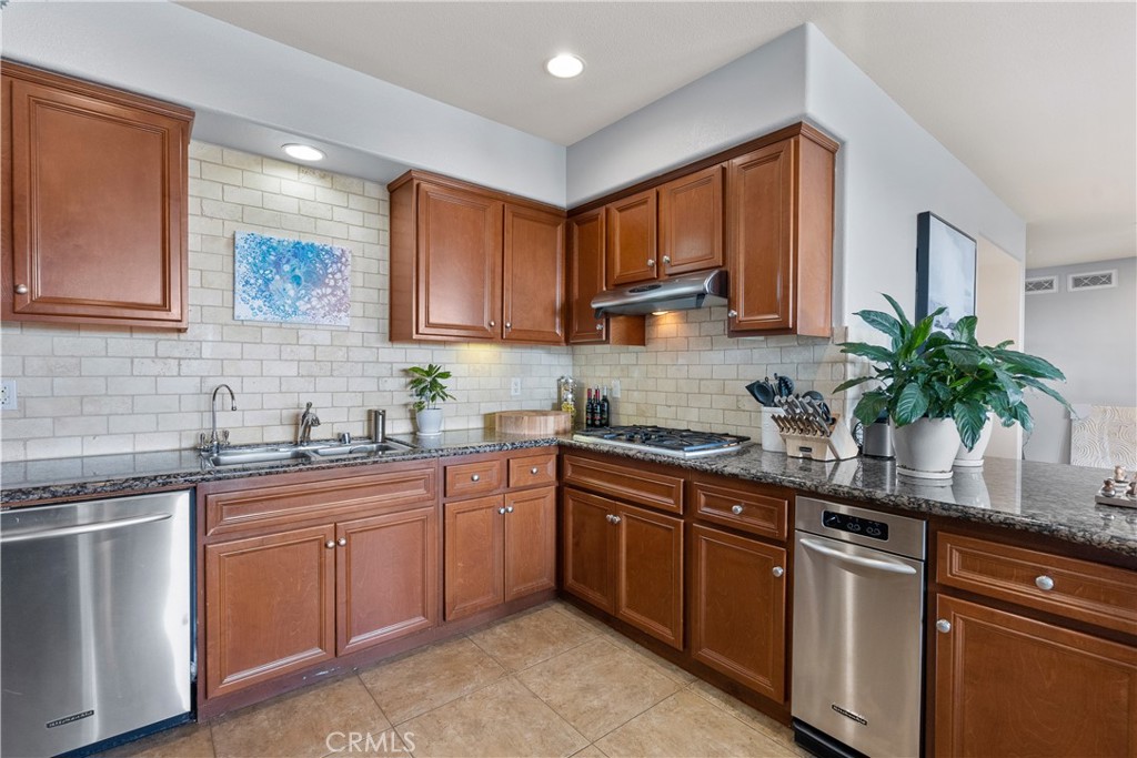 4240 Tradewinds Drive Oxnard, CA 93035 - Photo 21 of 43 a kitchen with a sink stove and cabinets
