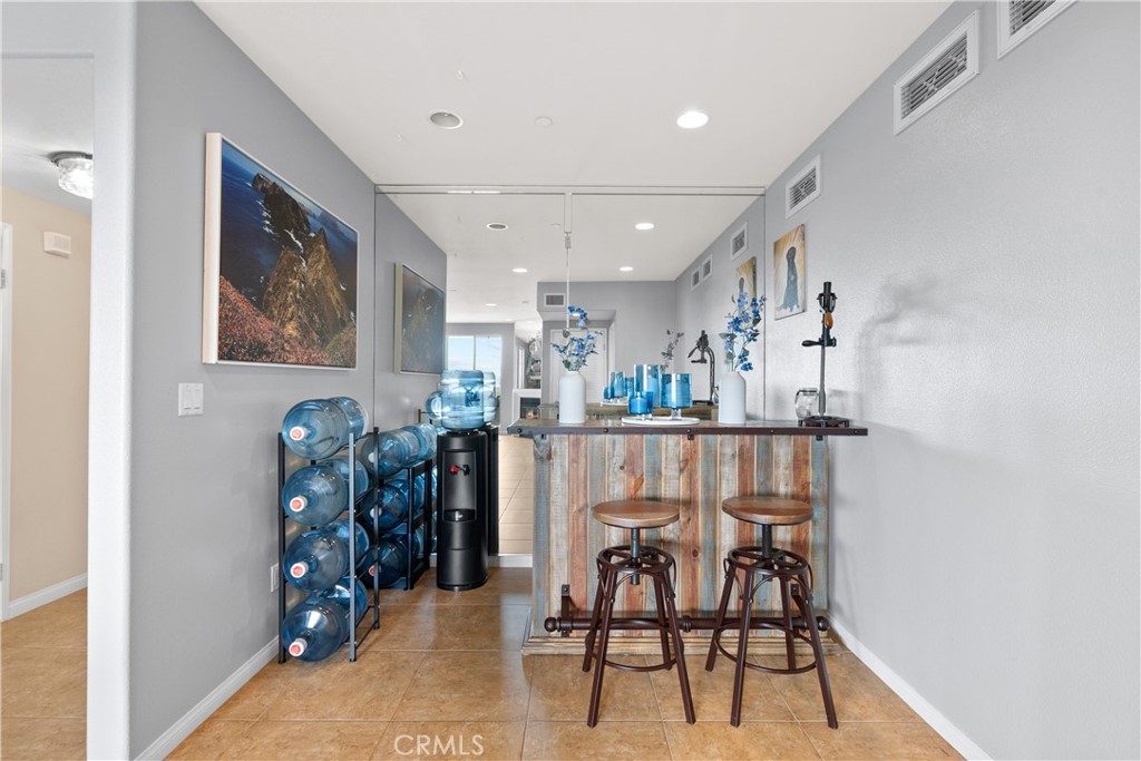 4240 Tradewinds Drive Oxnard, CA 93035 - Photo 24 of 43 a view of a dining room with furniture and chandelier