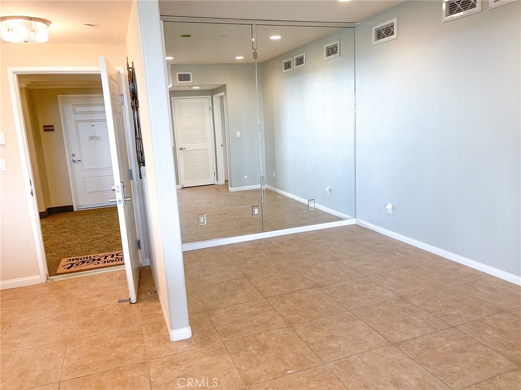 4240 Tradewinds Drive Oxnard, CA 93035 - Photo 26 of 43 a view of a room with an empty space and wooden floor