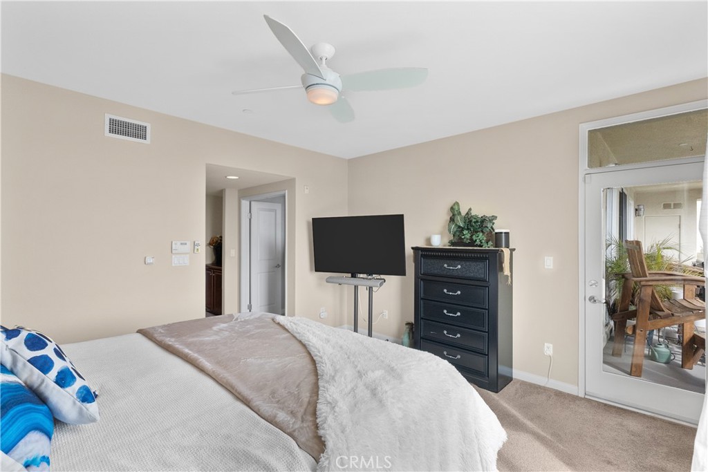 4240 Tradewinds Drive Oxnard, CA 93035 - Photo 30 of 43 a bedroom with a bed and a flat screen tv