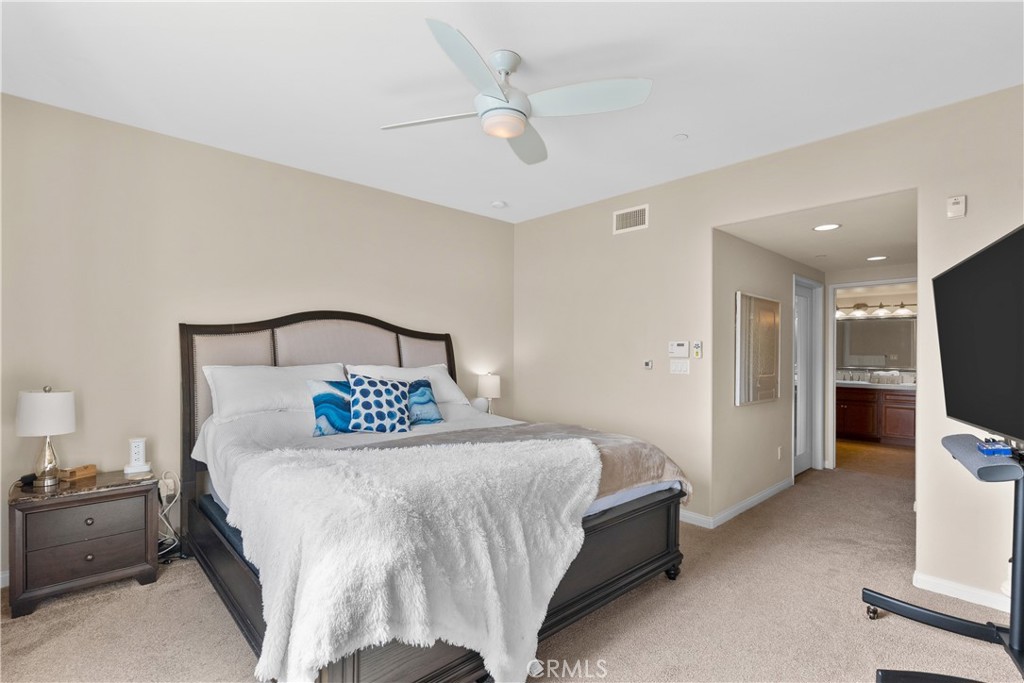 4240 Tradewinds Drive Oxnard, CA 93035 - Photo 31 of 43 a bedroom with a bed and a flat screen tv