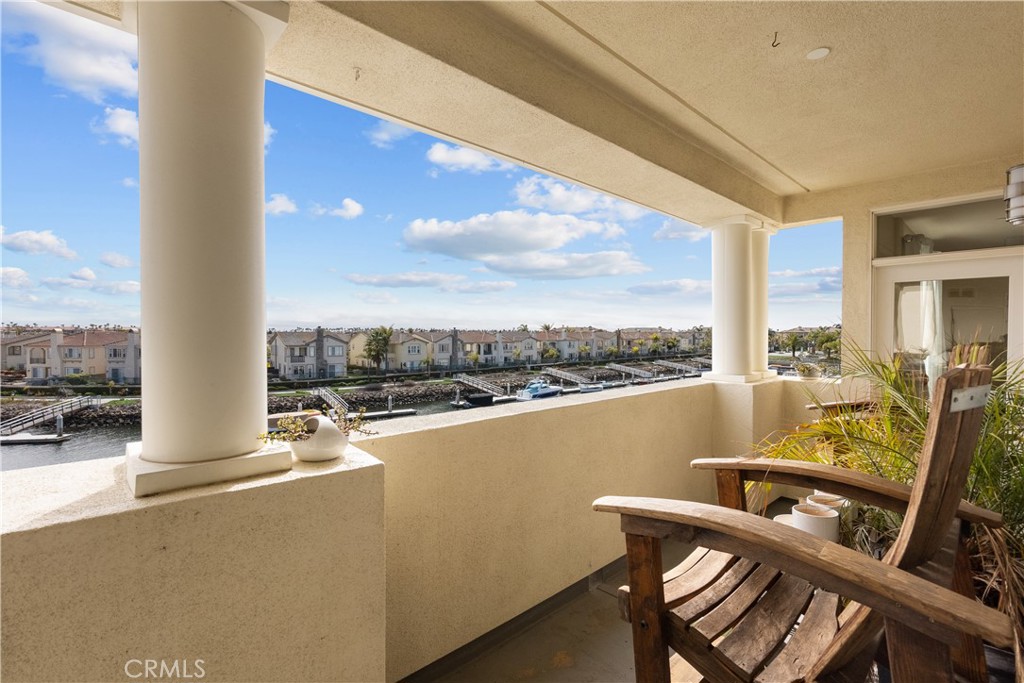4240 Tradewinds Drive Oxnard, CA 93035 - Photo 8 of 43 a view of a balcony with table and chairs