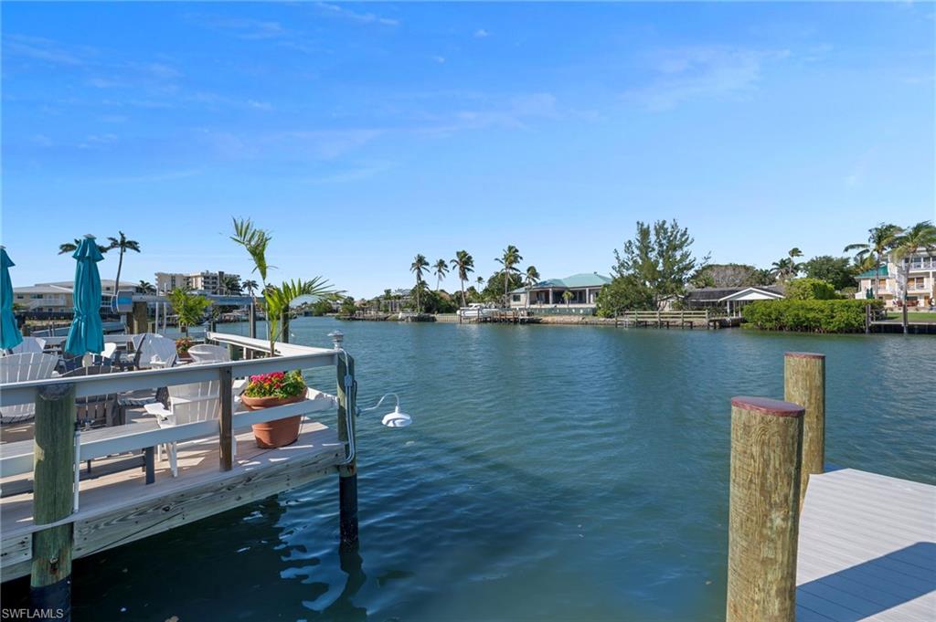 1950 Gulf Shore Boulevard North, Unit 108 Naples, FL 34102 - Photo 18 of 19 a view of a lake with boats