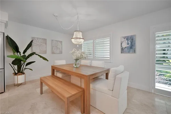 a view of living room with furniture and a window