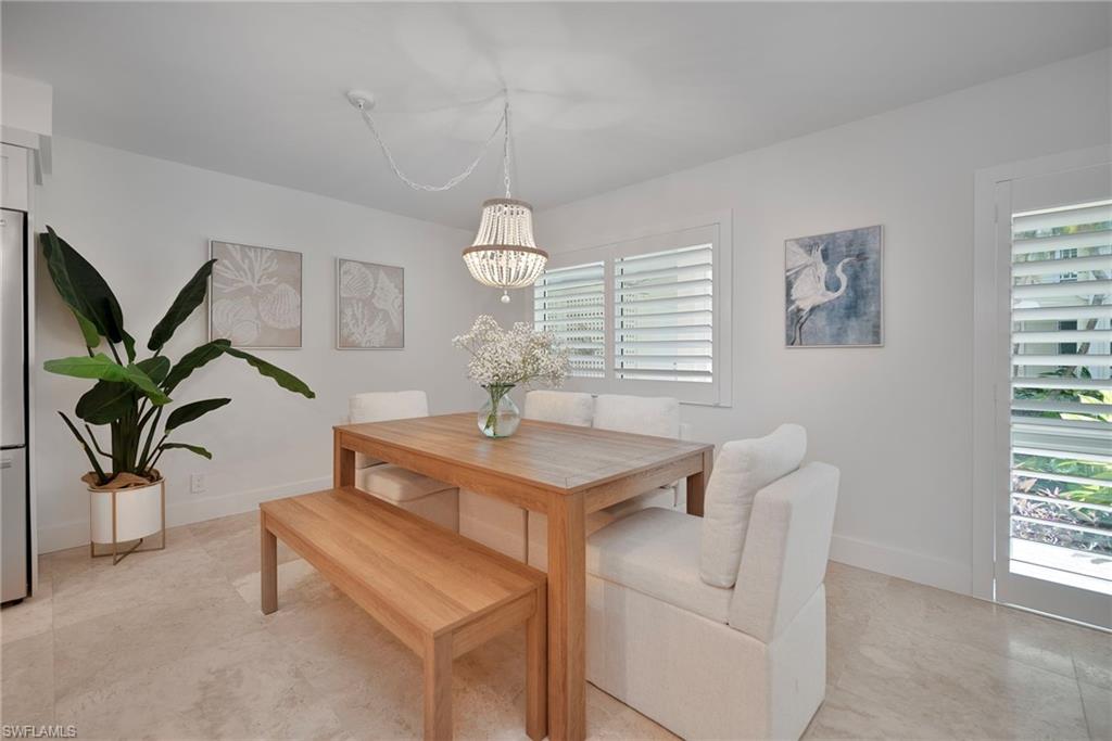 1950 Gulf Shore Boulevard North, Unit 108 Naples, FL 34102 - Photo 8 of 19 a view of living room with furniture and a window