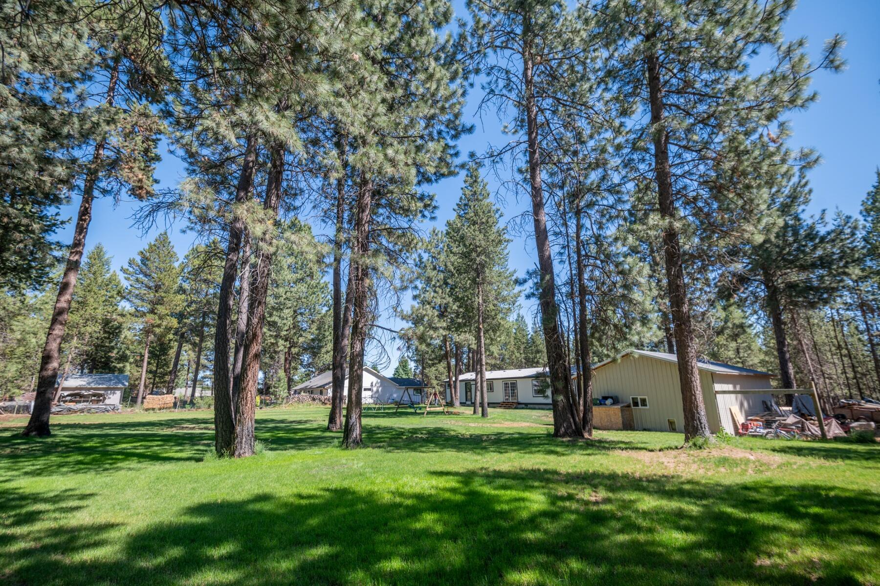 16990 Covina Road Bend, OR 97707 - Photo 42 of 56 a view of a big yard with plants and trees