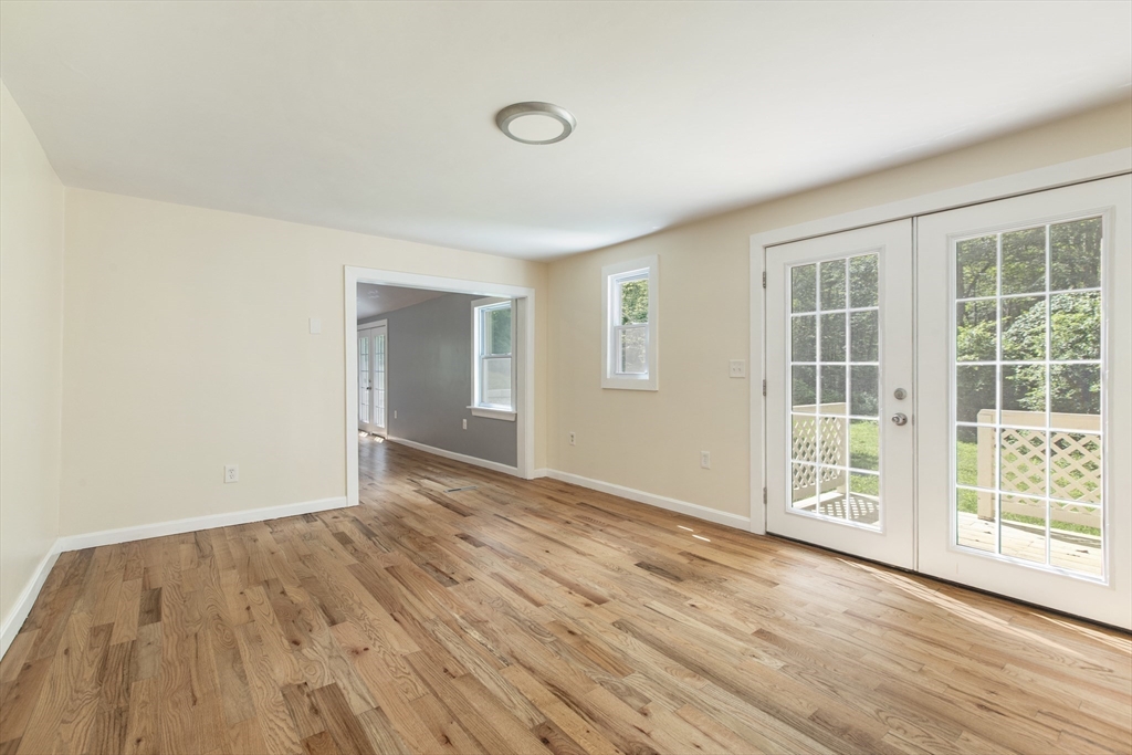 68 Birch Hill Road Douglas, MA 01516 - Photo 13 of 40 a view of an empty room with wooden floor and a window
