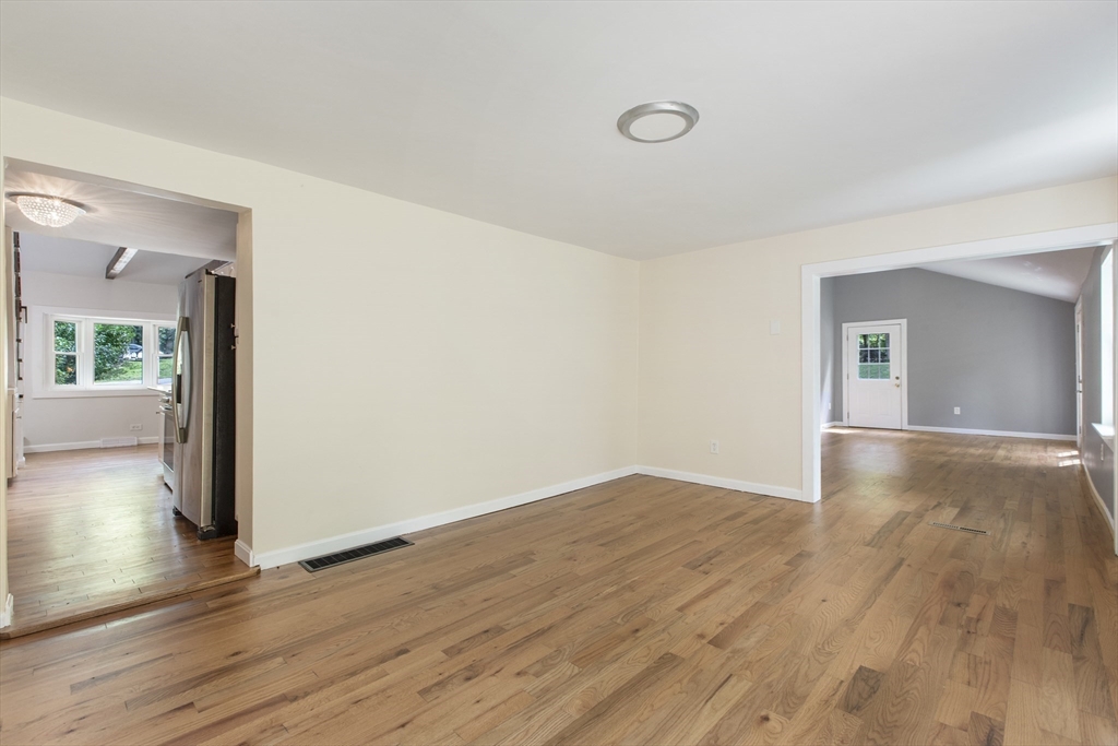 68 Birch Hill Road Douglas, MA 01516 - Photo 14 of 40 a view of an empty room with wooden floor and a window