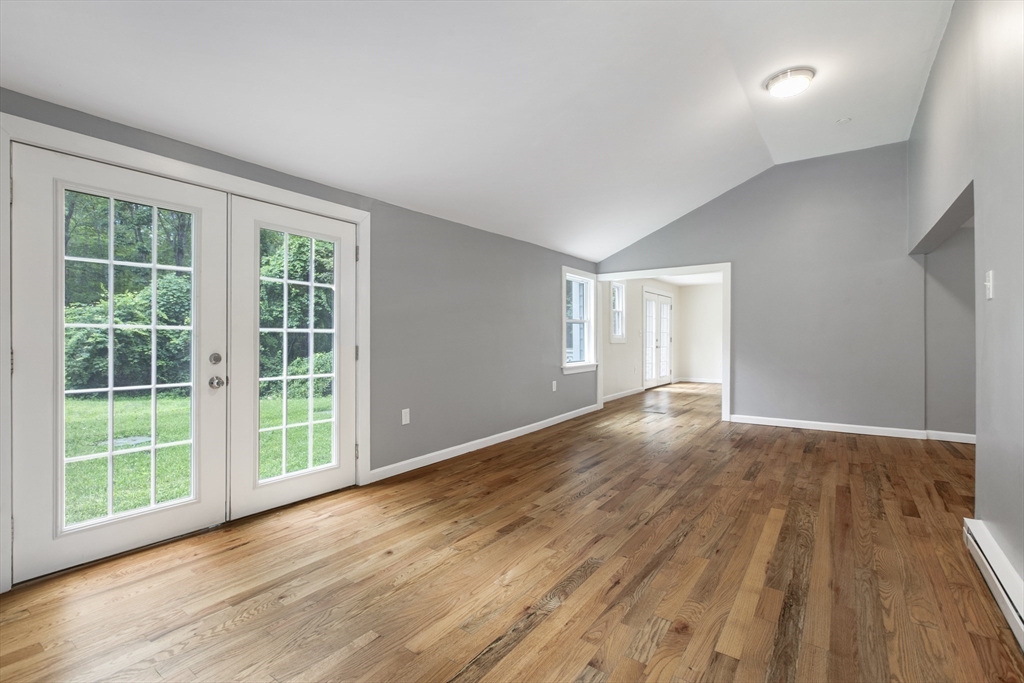 68 Birch Hill Road Douglas, MA 01516 - Photo 15 of 40 a view of an empty room with wooden floor and a window