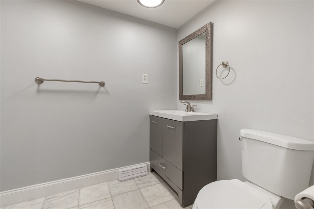 68 Birch Hill Road Douglas, MA 01516 - Photo 19 of 40 a bathroom with a sink a toilet and mirror