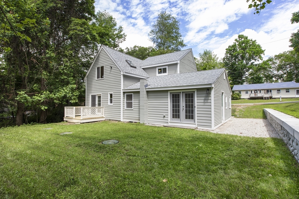 68 Birch Hill Road Douglas, MA 01516 - Photo 2 of 40 a front view of a house with a garden and yard