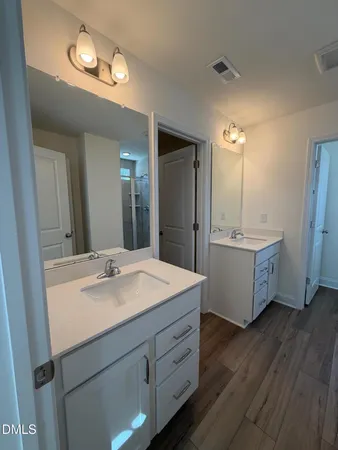 a bathroom with a toilet sink and window