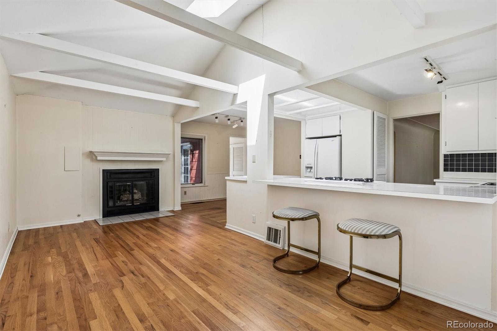 815 Oneida Street Denver, CO 80220 - Photo 16 of 39 a view of a livingroom with furniture and a fireplace