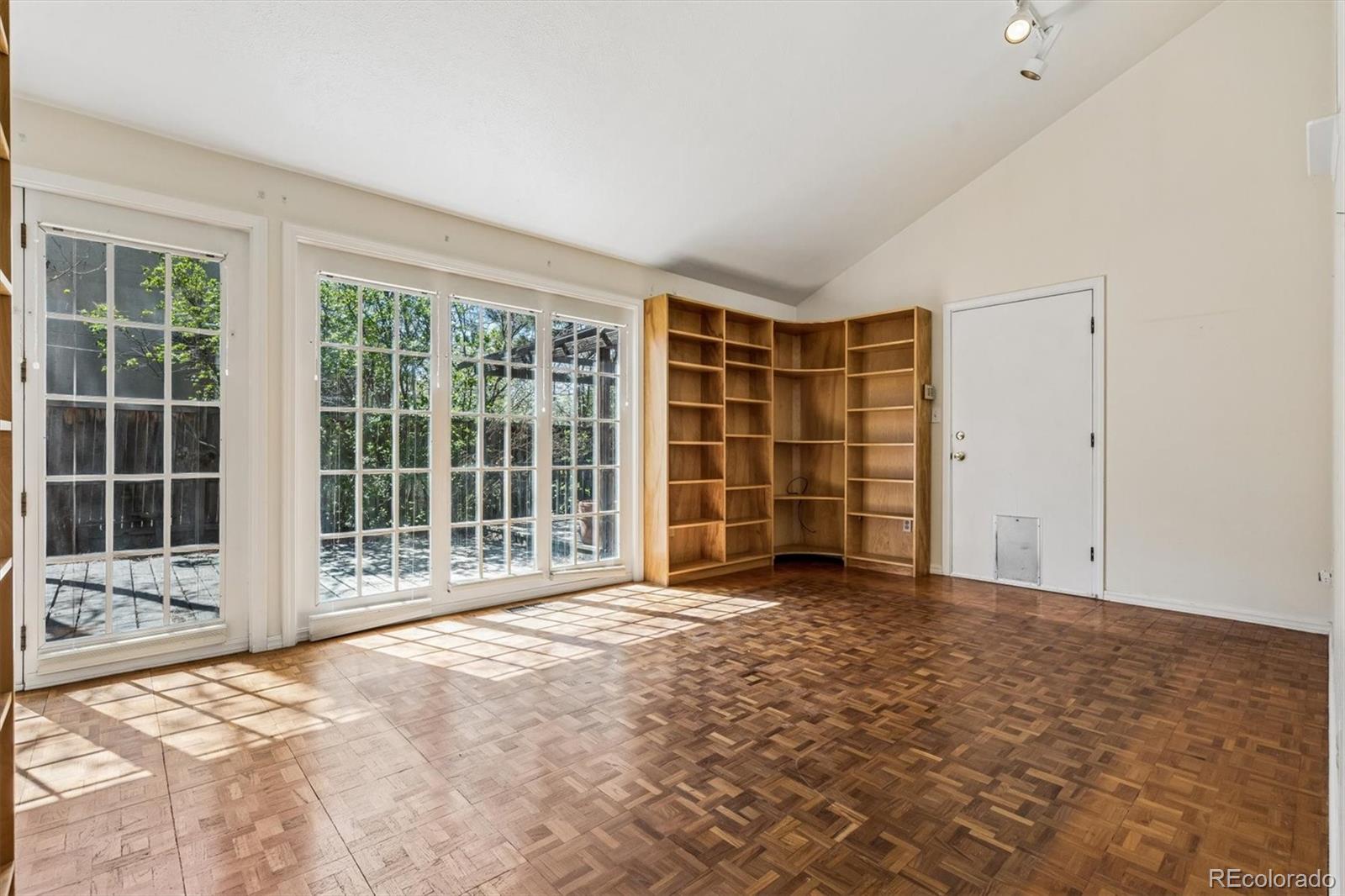 815 Oneida Street Denver, CO 80220 - Photo 22 of 39 a view of an empty room with a window