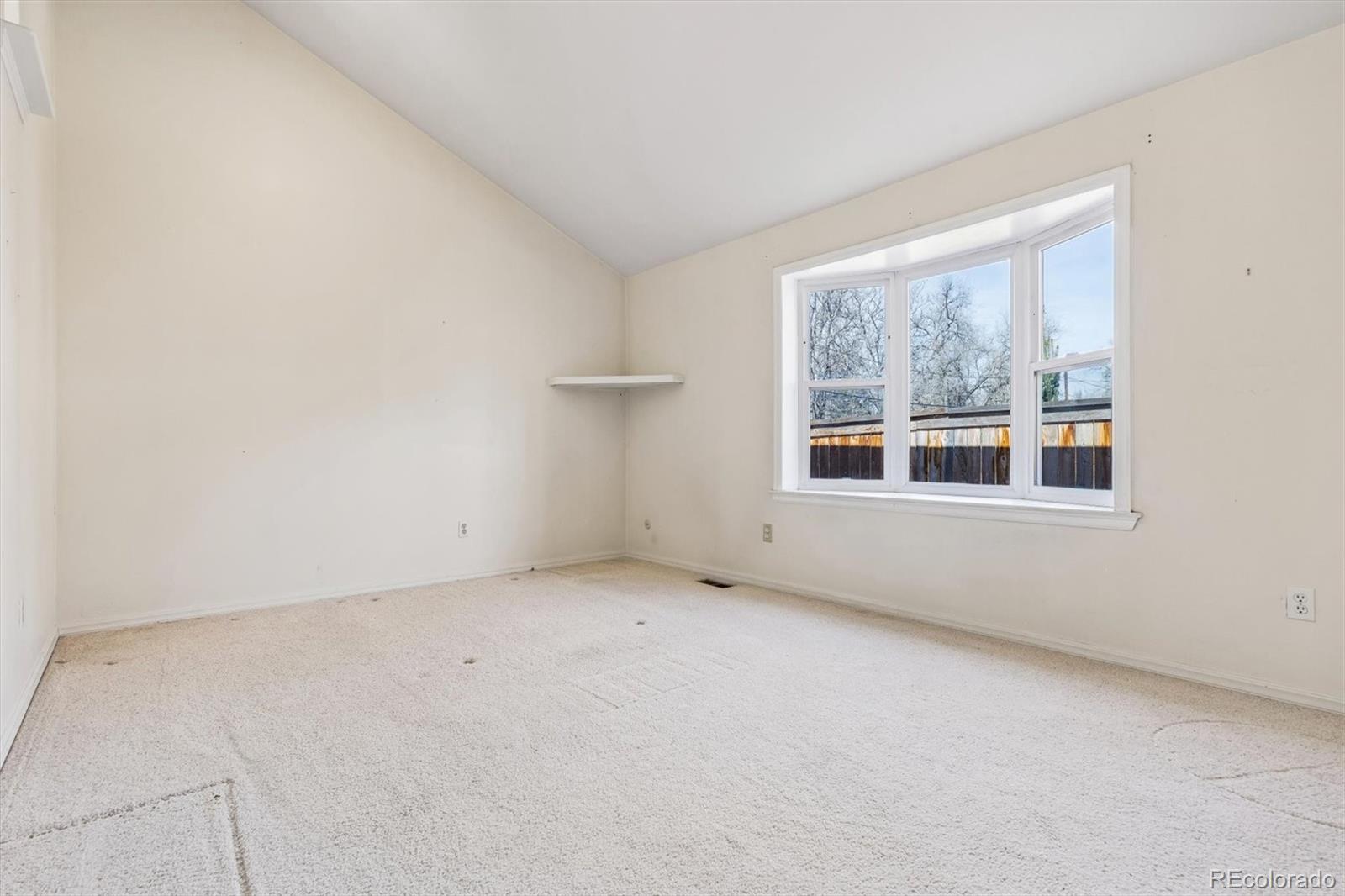 815 Oneida Street Denver, CO 80220 - Photo 24 of 39 an empty room with a window