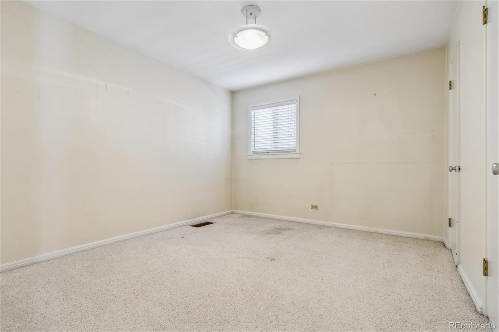 815 Oneida Street Denver, CO 80220 - Photo 28 of 39 an empty room with a fan