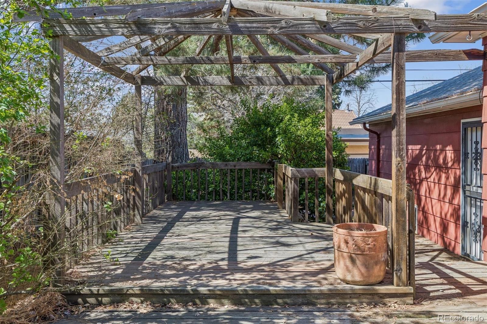 815 Oneida Street Denver, CO 80220 - Photo 31 of 39 a view of a patio with table and chairs