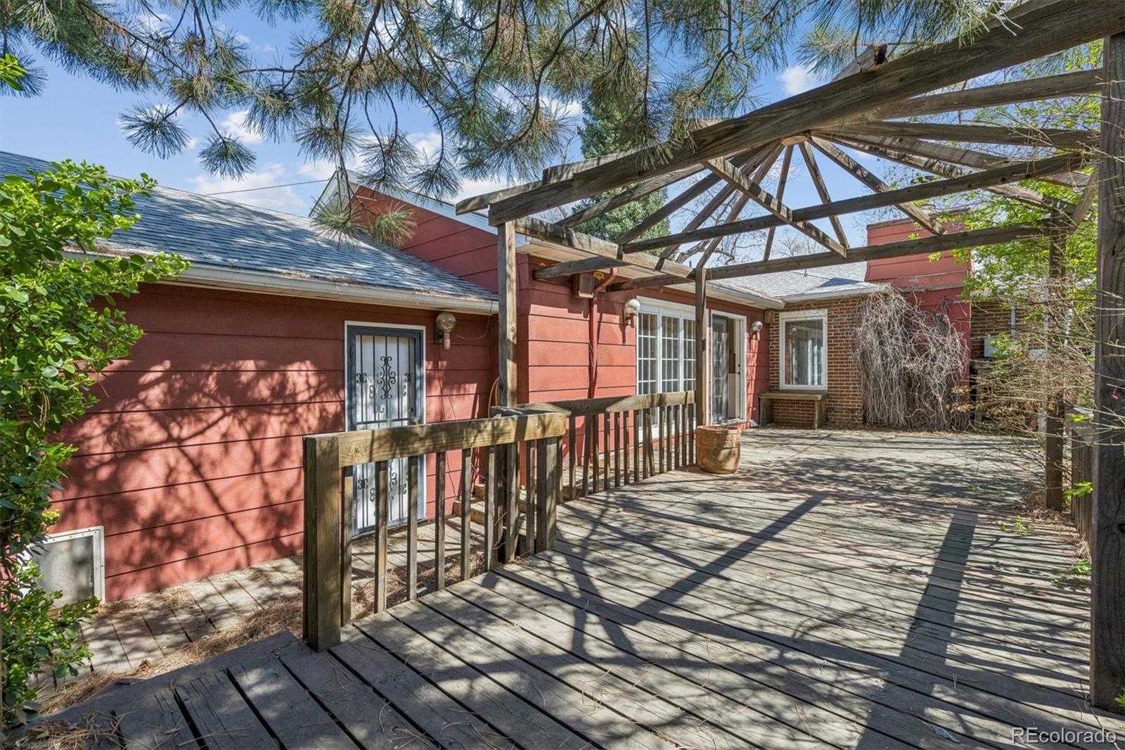 815 Oneida Street Denver, CO 80220 - Photo 32 of 39 a view of a chairs and table in the patio