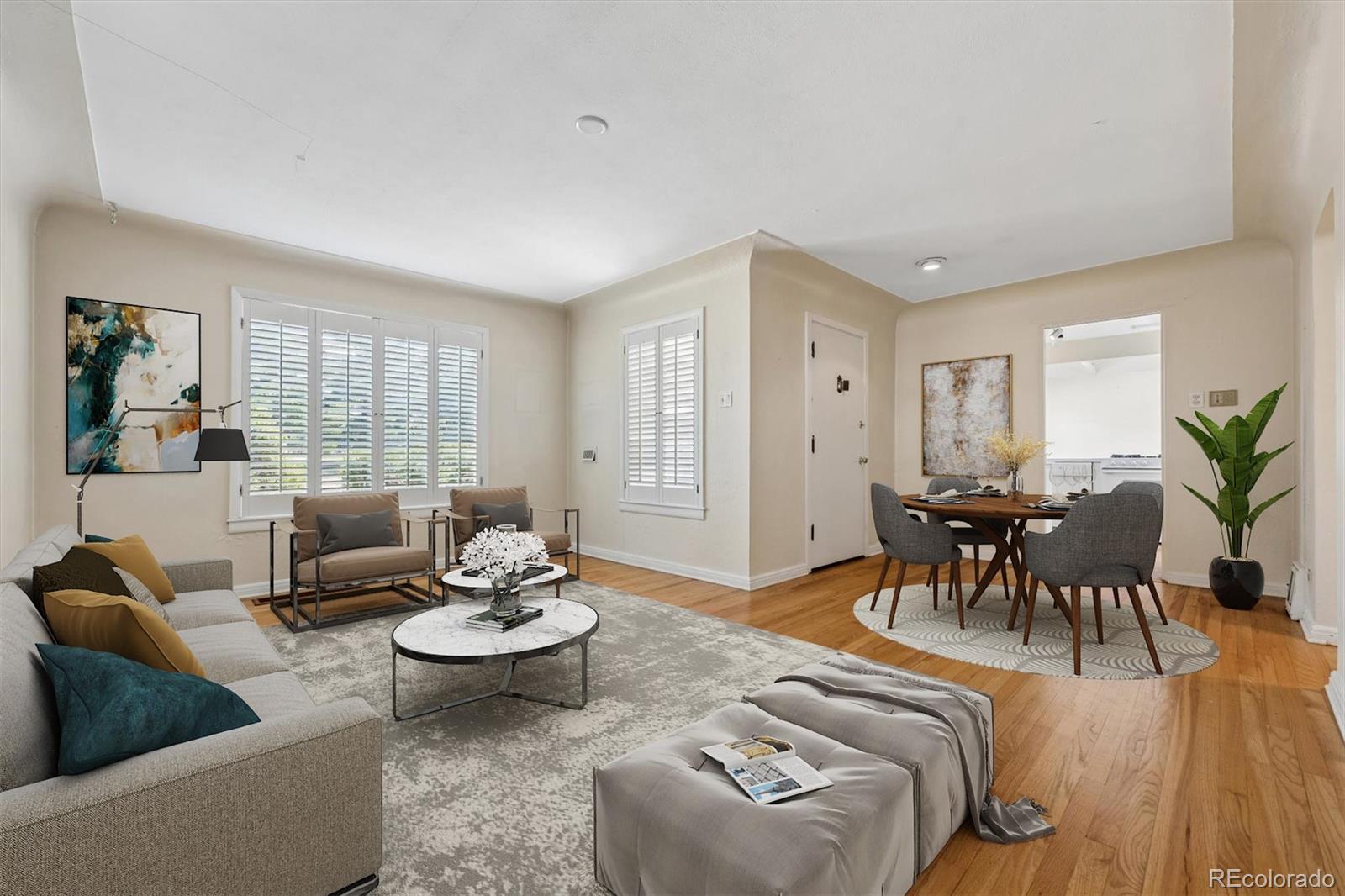 815 Oneida Street Denver, CO 80220 - Photo 5 of 39 a living room with furniture and a large window