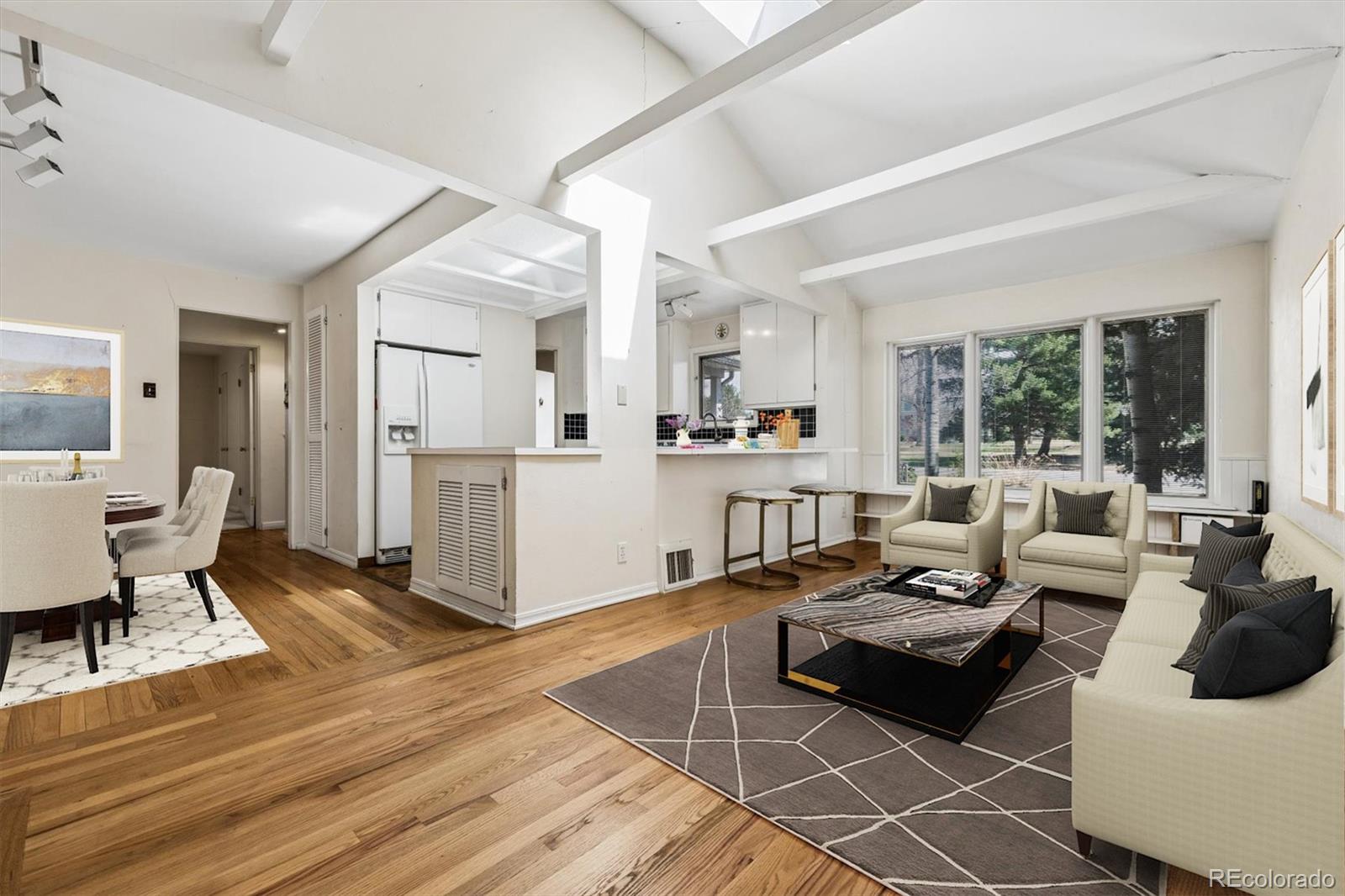815 Oneida Street Denver, CO 80220 - Photo 6 of 39 a living room with furniture and a table