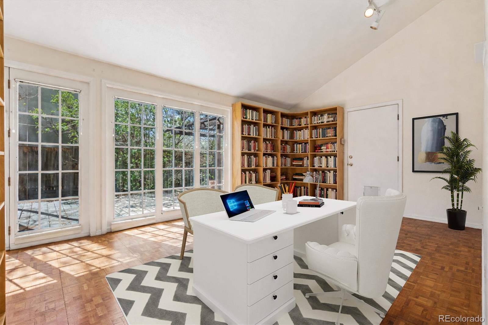 815 Oneida Street Denver, CO 80220 - Photo 8 of 39 a view of a dining room with furniture window and outside view