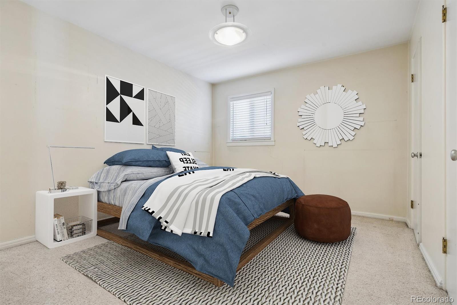 815 Oneida Street Denver, CO 80220 - Photo 10 of 39 a bedroom with a bed and a chandelier