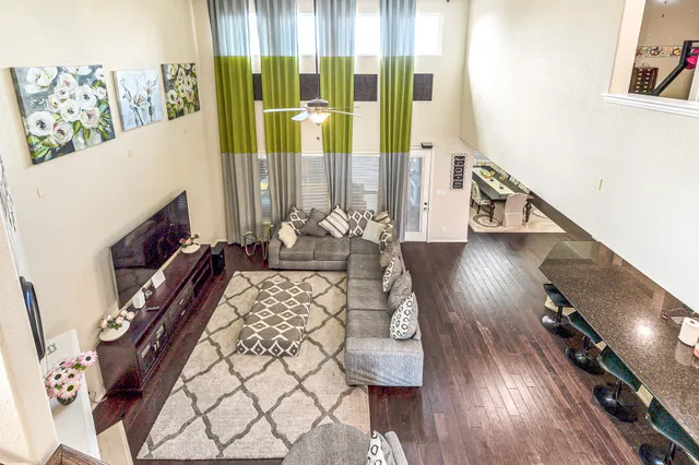 a view of living room with furniture and wooden floor