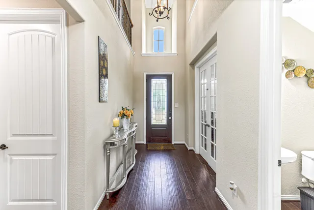 a view of an entryway with wooden floor