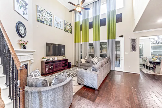 a living room with fireplace furniture and a flat screen tv