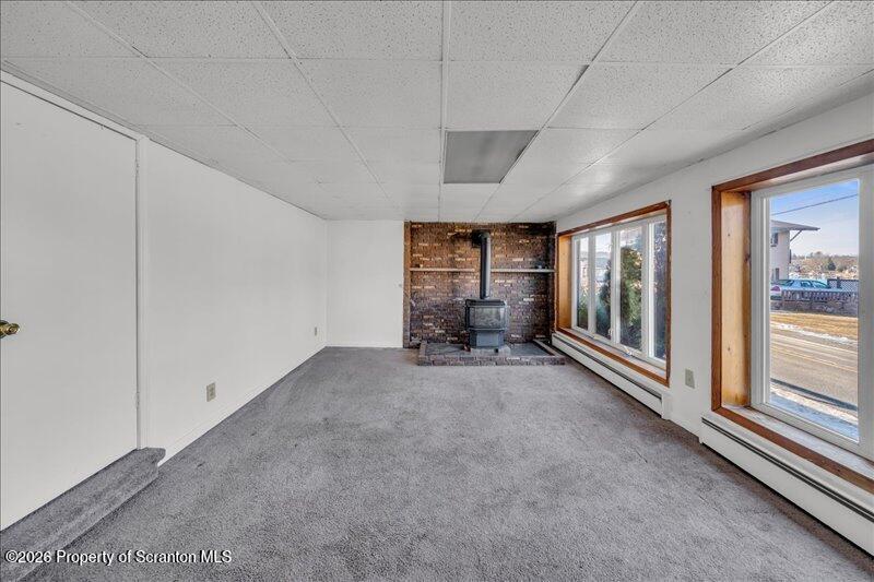 1228 Lake Road Factoryville, PA 18419 - Photo 5 of 43 a view of an empty room with a fireplace