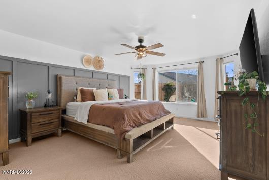 552 Spur Court Fernley, NV 89408 - Photo 23 of 46 a bed room with a bed and a chandelier