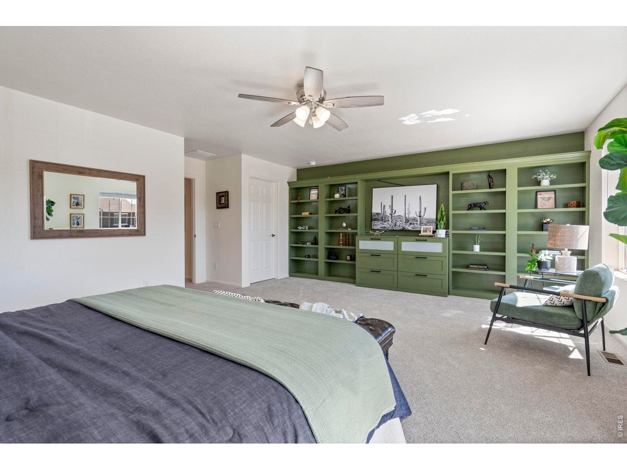 10080 Cedar Street Firestone, CO 80504 - Photo 19 of 38 Stylish built in with drawers and shelving with room in the center for a large tv or art piece