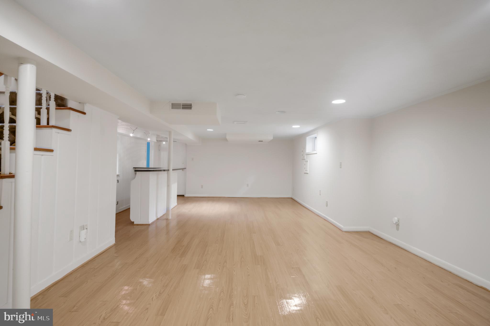 3111 North Thomas Street Arlington, VA 22207 - Photo 27 of 40 a view of empty room with wooden floor