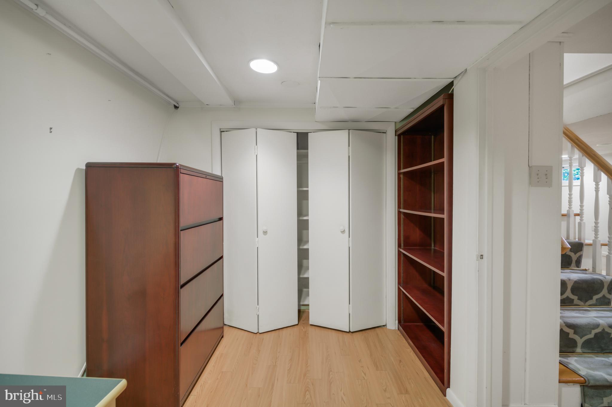 3111 North Thomas Street Arlington, VA 22207 - Photo 34 of 40 a view of walk in closet with empty racks