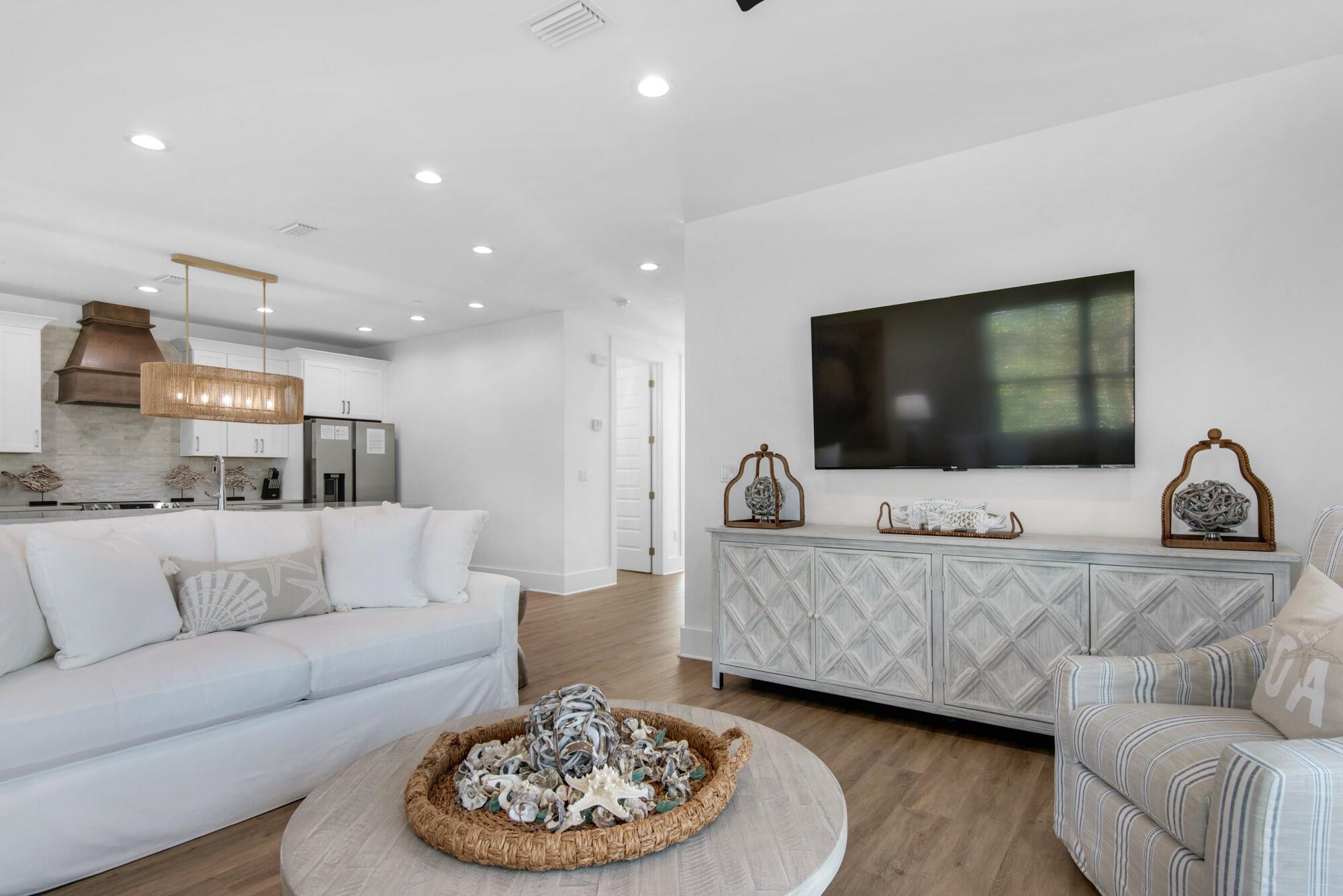 6528 West County Highway 30A Santa Rosa Beach, FL 32459 - Photo 12 of 87 a living room with furniture and a flat screen tv