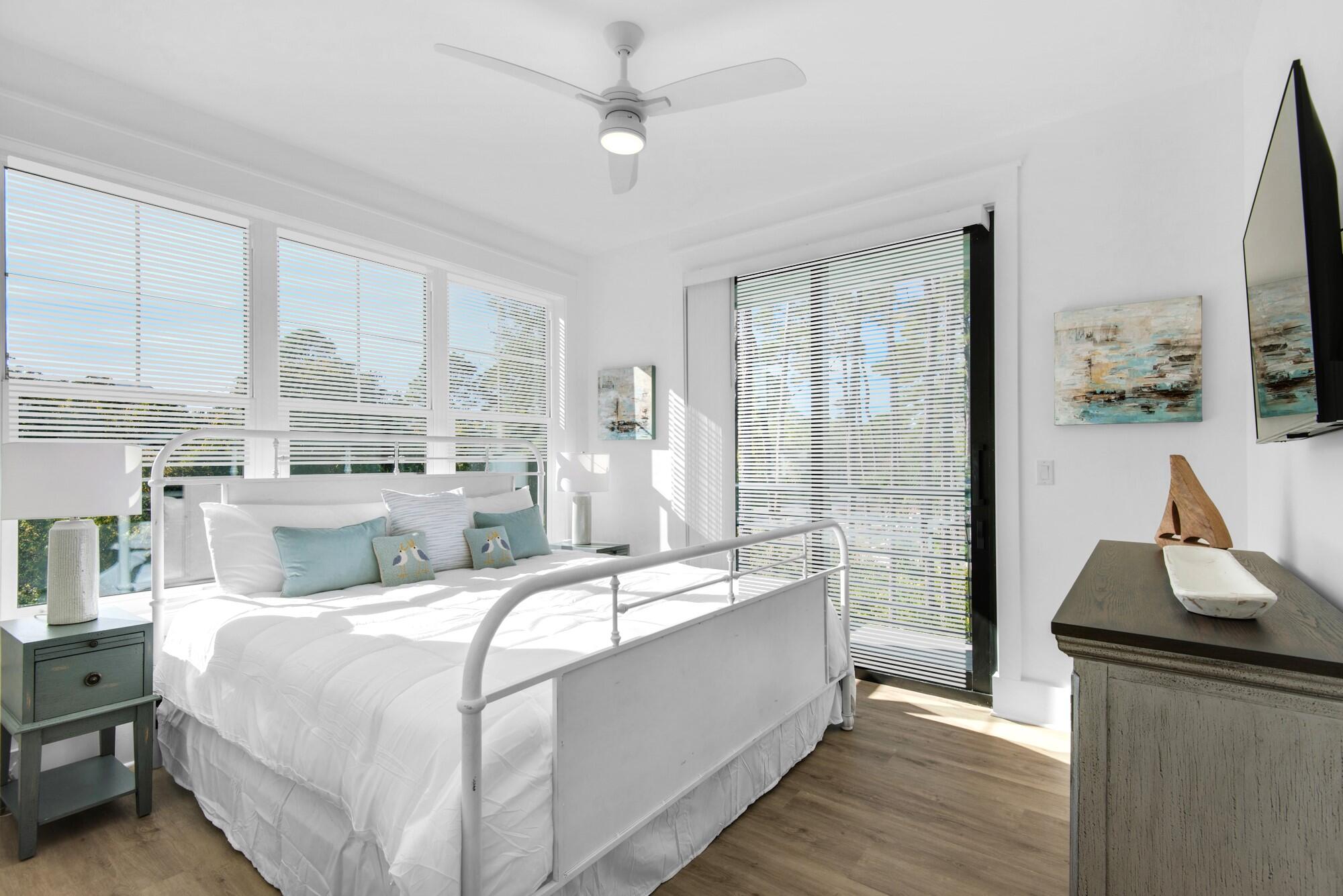 6528 West County Highway 30A Santa Rosa Beach, FL 32459 - Photo 16 of 87 a bed room with a bed and a large window