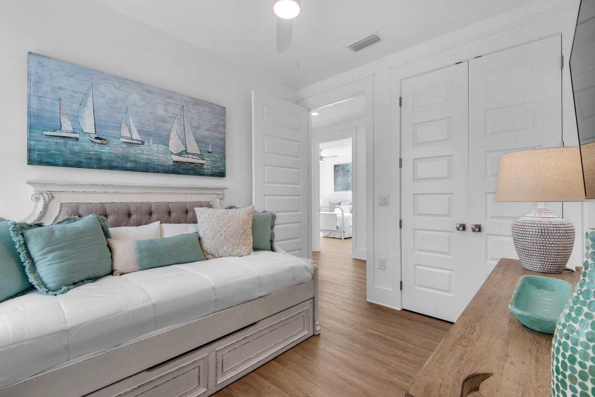 6528 West County Highway 30A Santa Rosa Beach, FL 32459 - Photo 19 of 87 a living room with furniture and wooden floor
