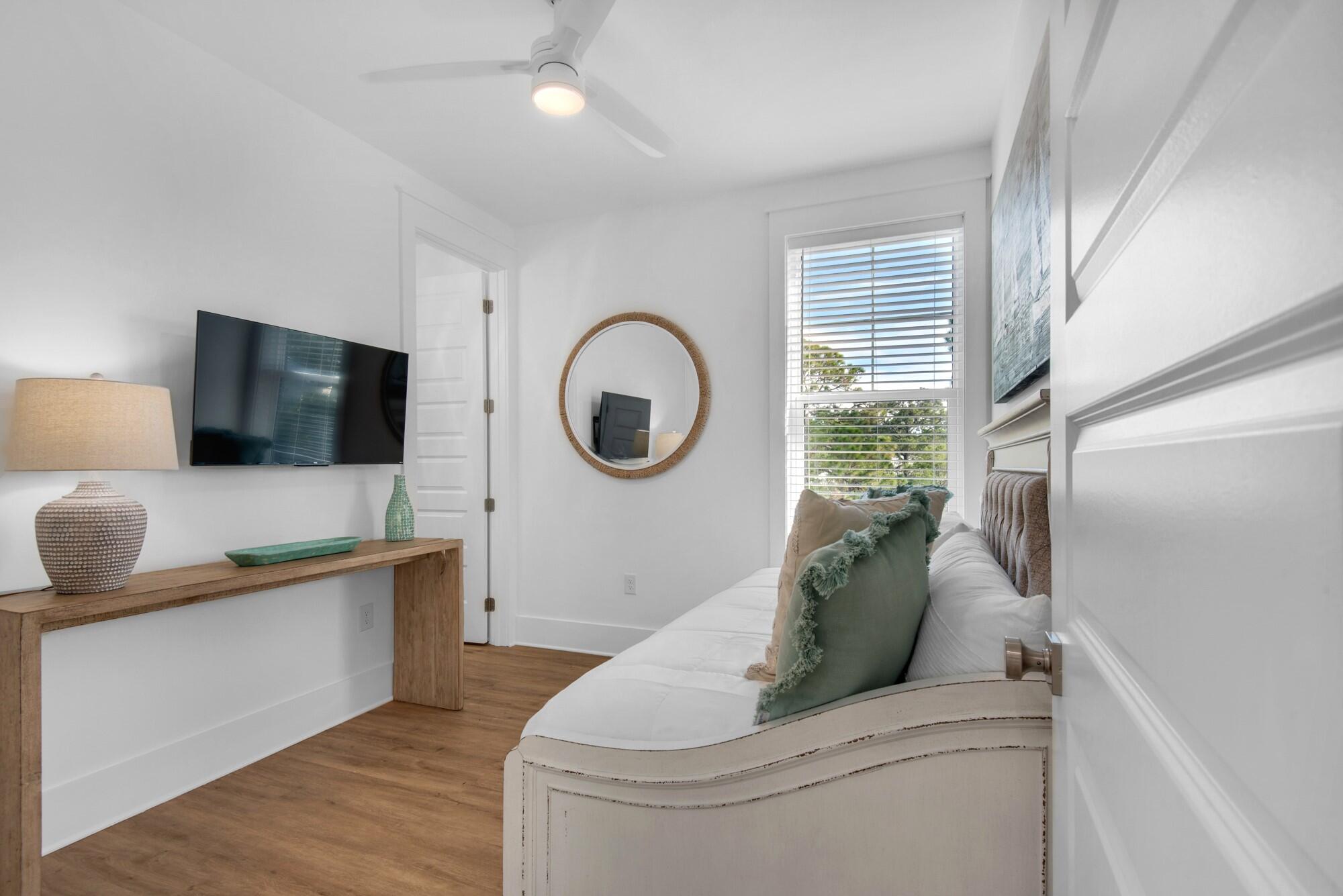 6528 West County Highway 30A Santa Rosa Beach, FL 32459 - Photo 20 of 87 a living room with furniture and a flat screen tv