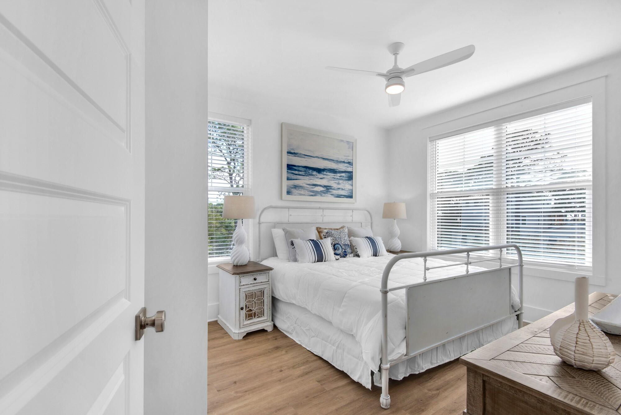 6528 West County Highway 30A Santa Rosa Beach, FL 32459 - Photo 22 of 87 a bedroom with a bed and a window