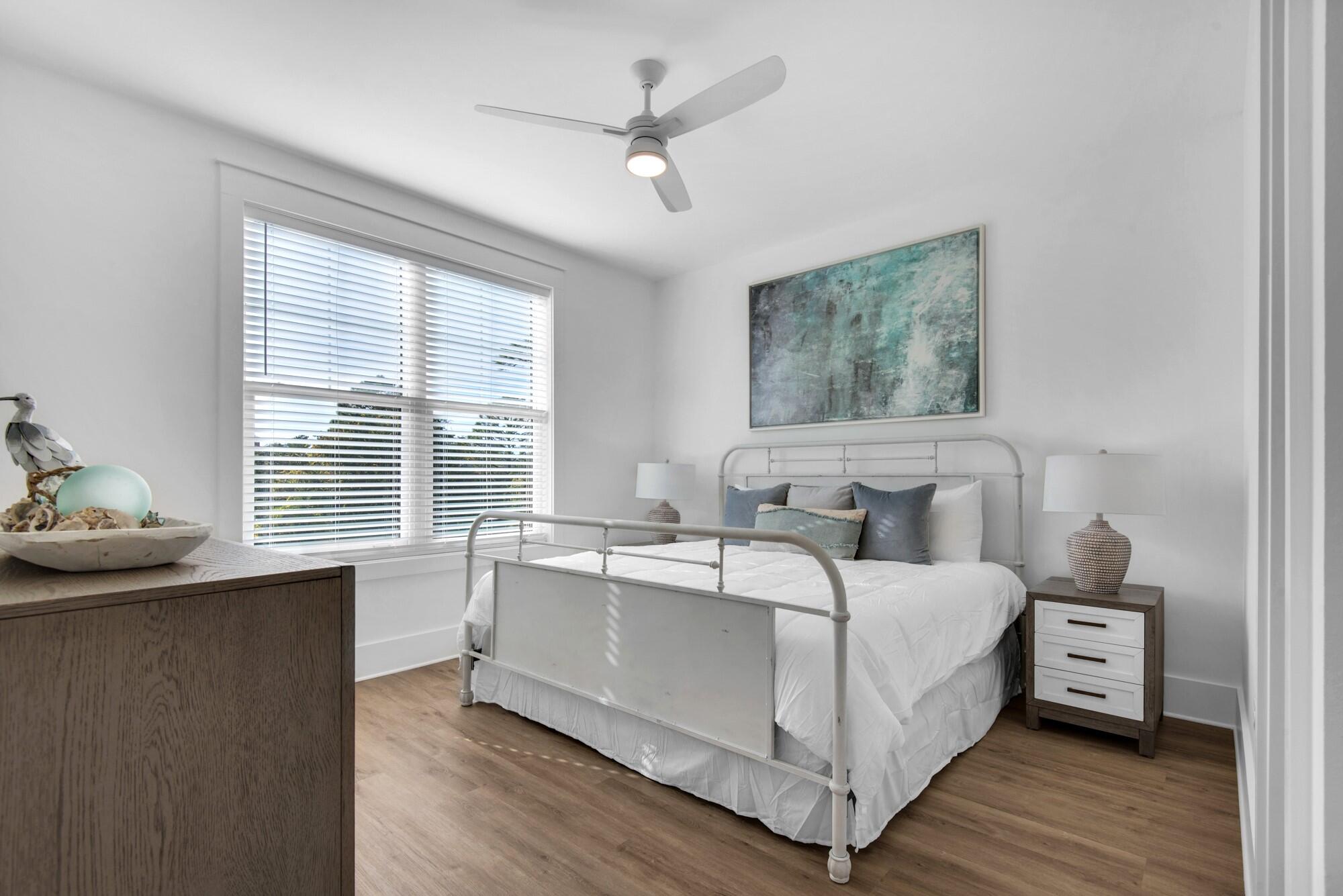 6528 West County Highway 30A Santa Rosa Beach, FL 32459 - Photo 25 of 87 a bed room with a bed and a table