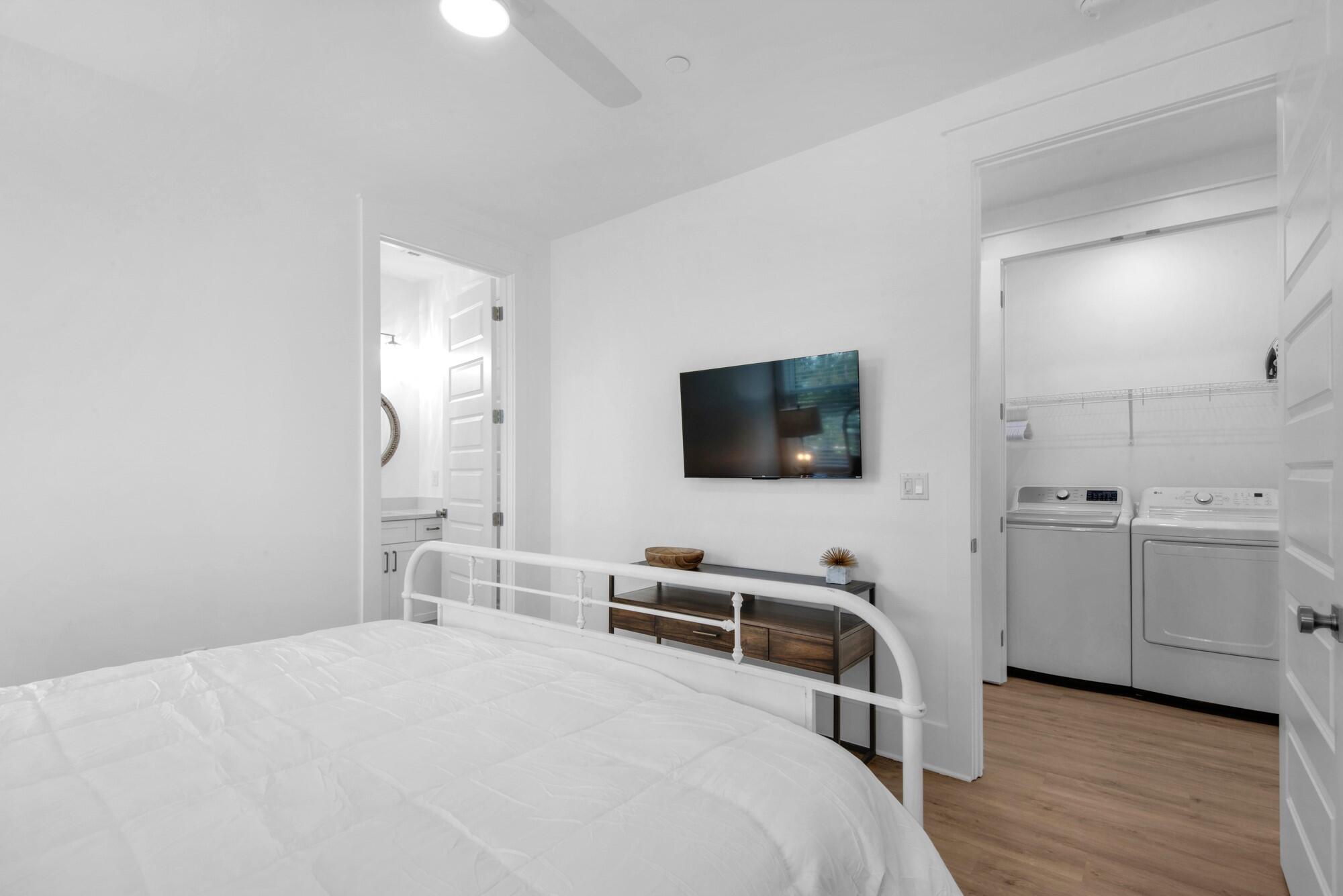 6528 West County Highway 30A Santa Rosa Beach, FL 32459 - Photo 29 of 87 a bedroom with a bed and a flat screen tv