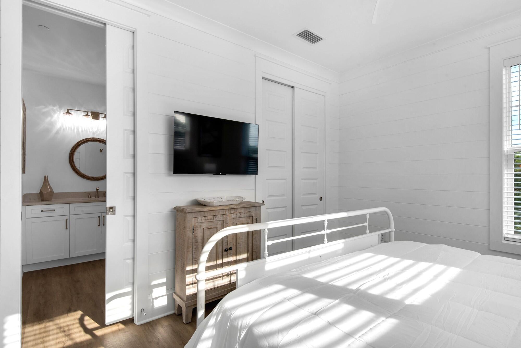 6528 West County Highway 30A Santa Rosa Beach, FL 32459 - Photo 36 of 87 a bedroom with a bed and flat screen tv