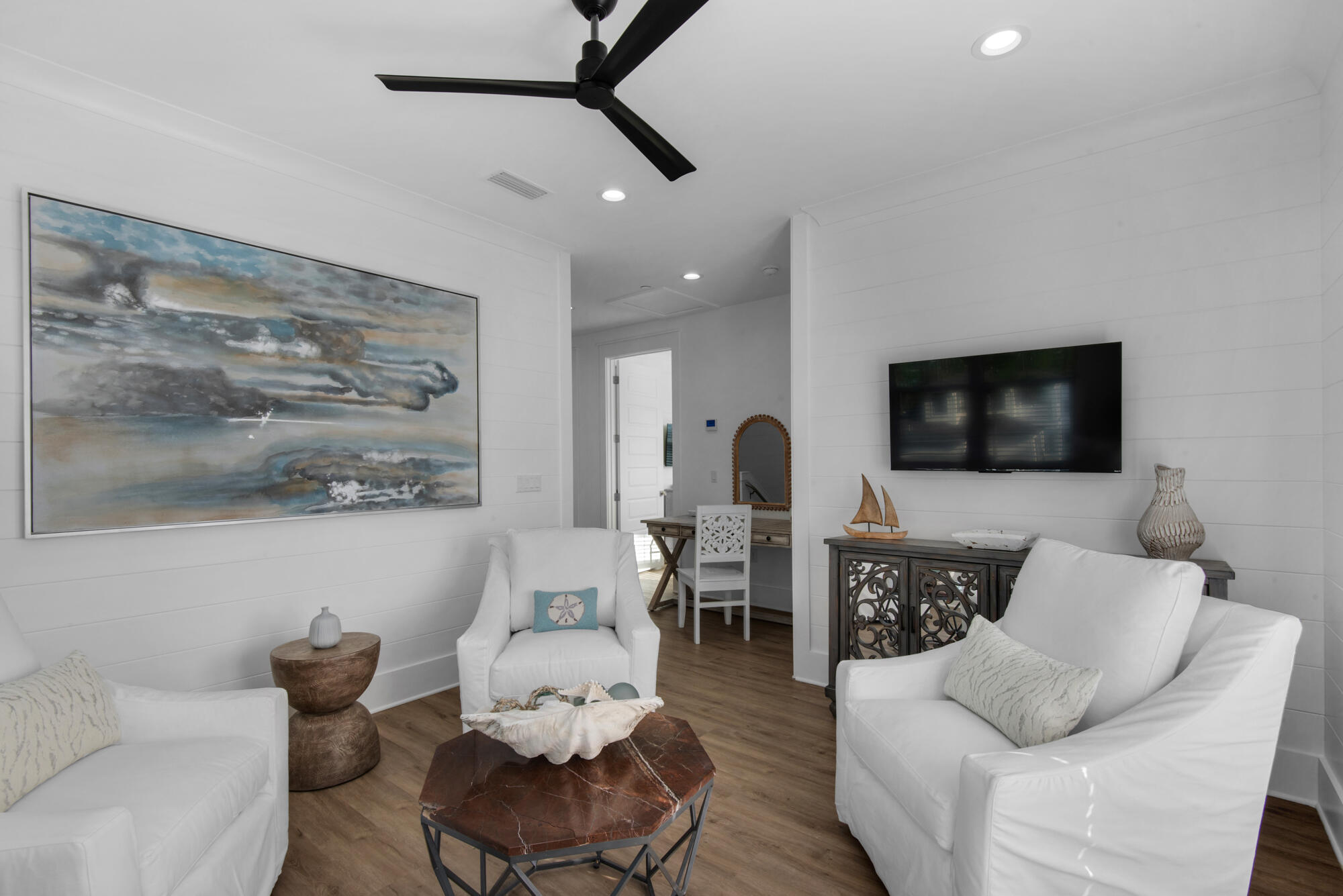 6528 West County Highway 30A Santa Rosa Beach, FL 32459 - Photo 41 of 87 a living room with furniture and a flat screen tv