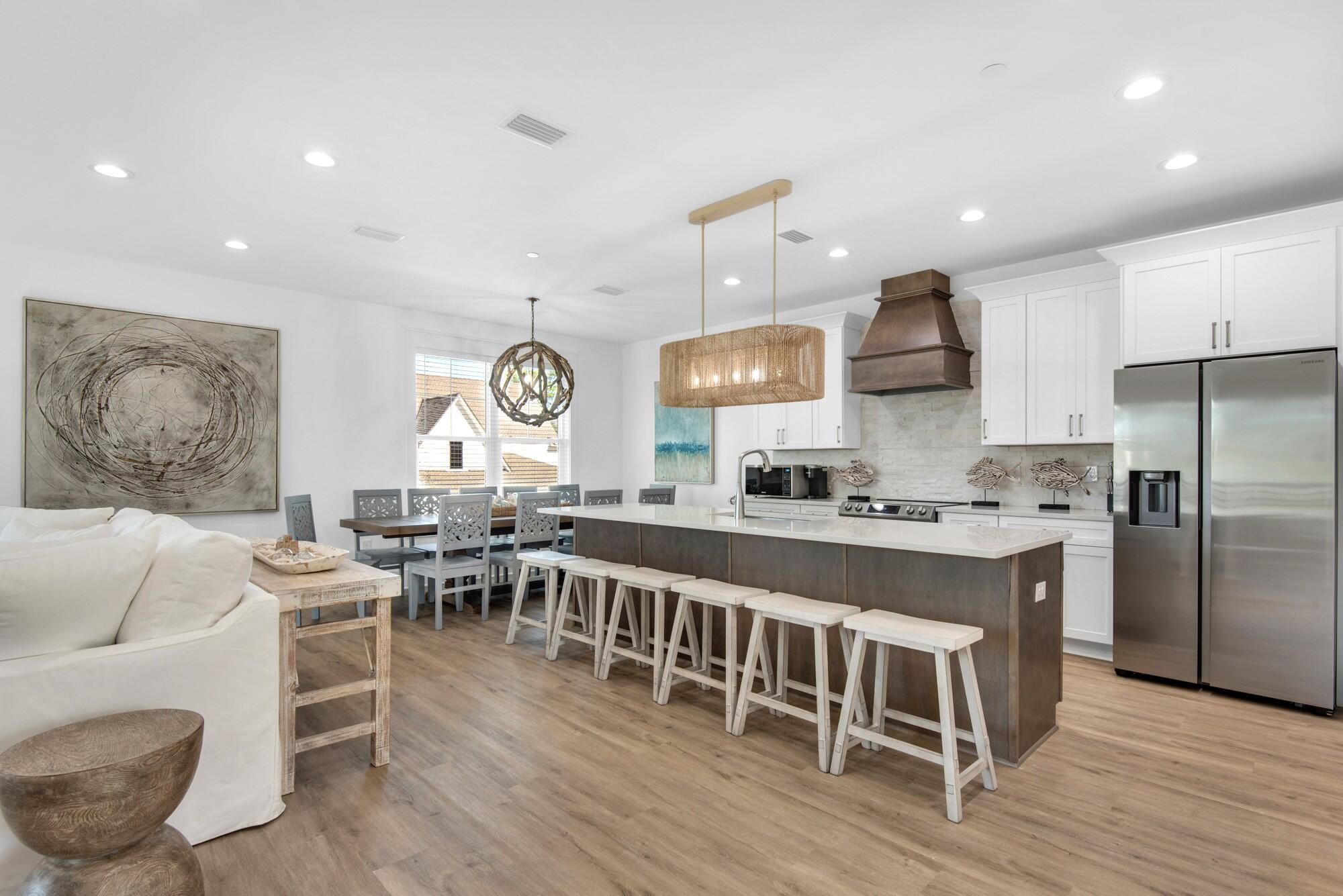 6528 West County Highway 30A Santa Rosa Beach, FL 32459 - Photo 6 of 87 a large kitchen with a large window and stainless steel appliances