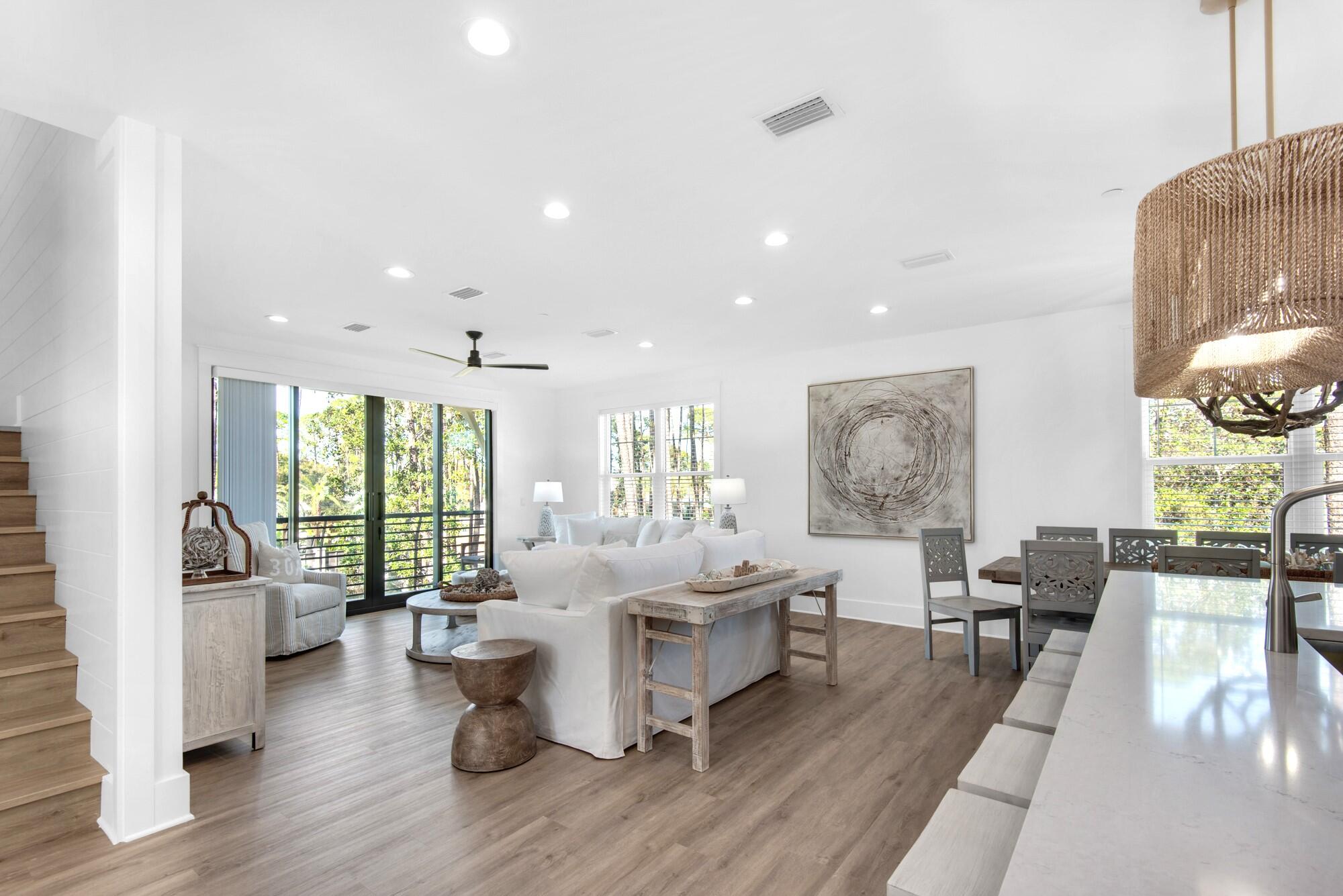 6528 West County Highway 30A Santa Rosa Beach, FL 32459 - Photo 9 of 87 a living room with furniture and wooden floor