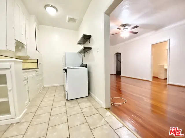 a view of a kitchen with wooden floor