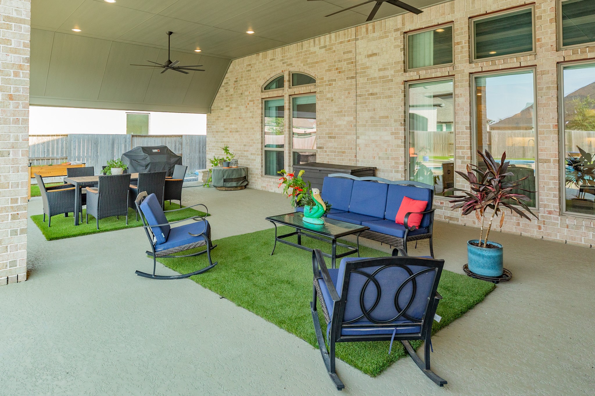 9538 Sanger Way Manvel, TX 77578 - Photo 33 of 50 Extended patio view showcasing the outdoor living space and backyard accessibility.
