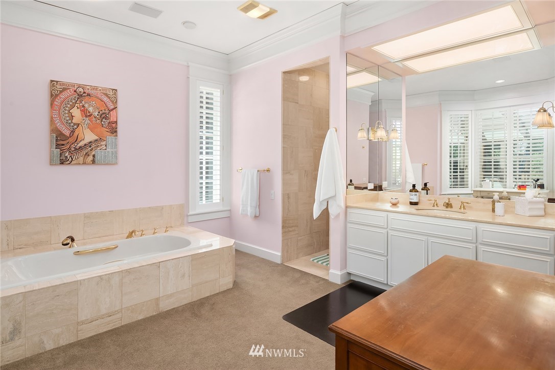 142 Moss Road Shoreline, WA 98177 - Photo 12 of 32 a spacious bathroom with a tub a sink and mirror