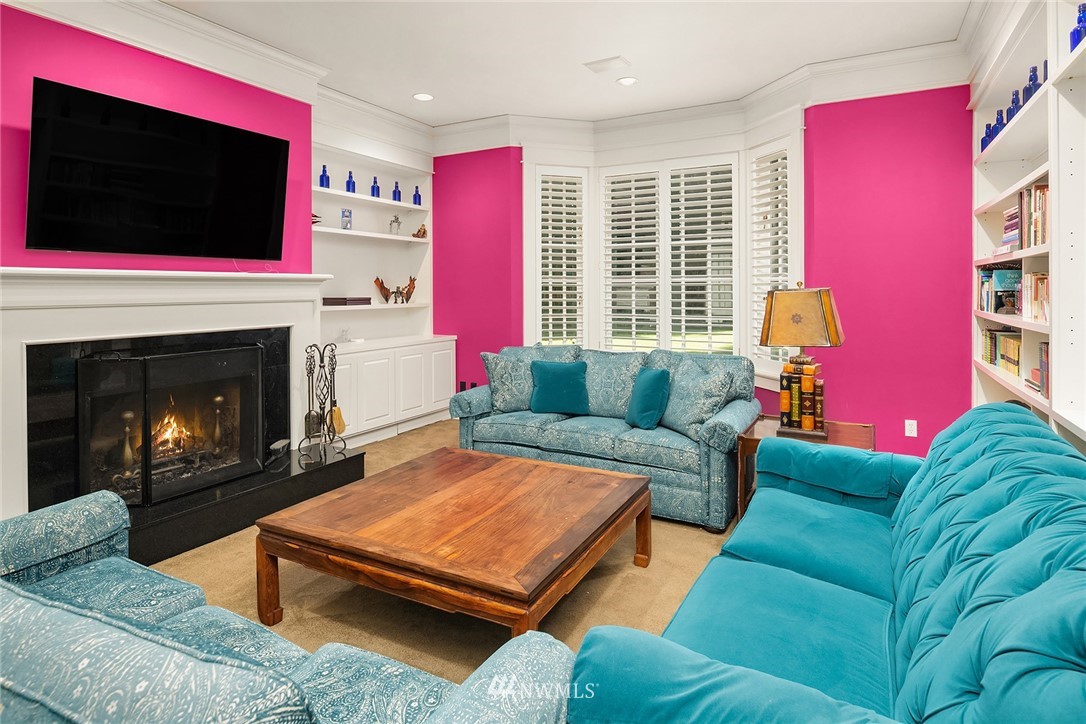 142 Moss Road Shoreline, WA 98177 - Photo 16 of 32 a living room with furniture a flat screen tv and a fireplace