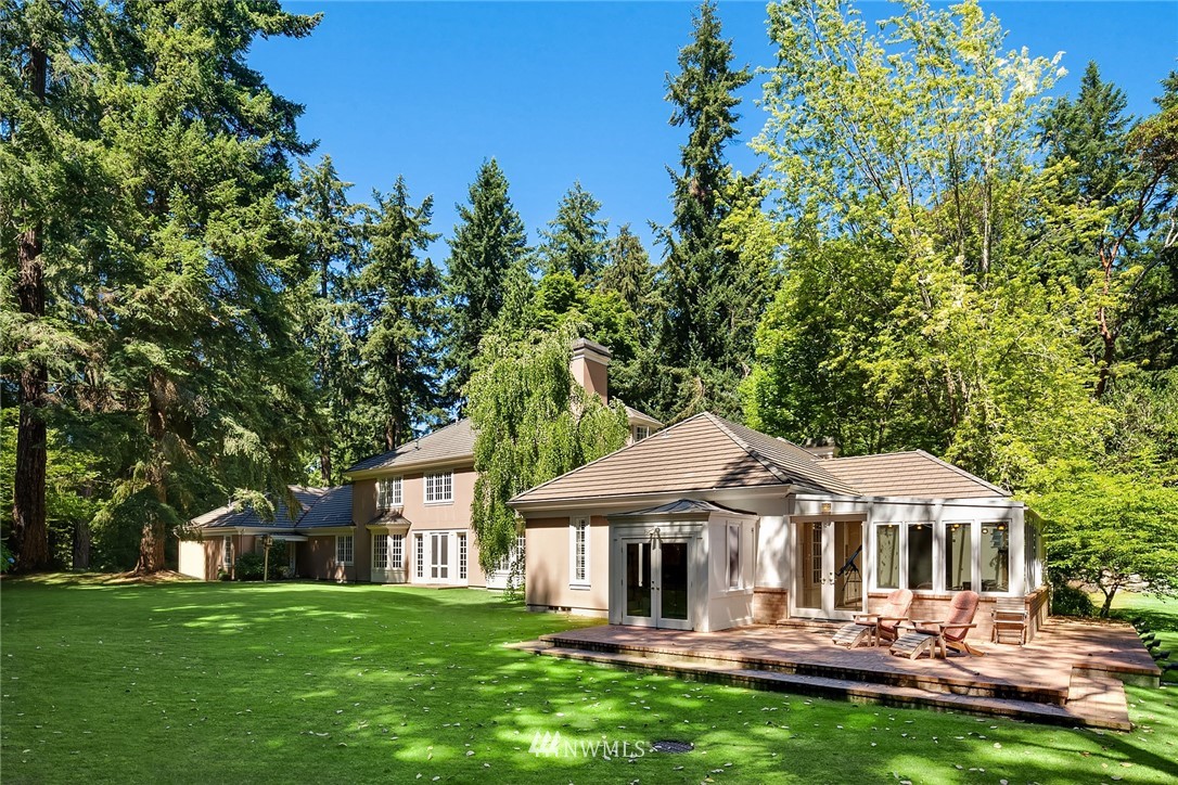 142 Moss Road Shoreline, WA 98177 - Photo 28 of 32 a front view of a house with a yard table and chairs